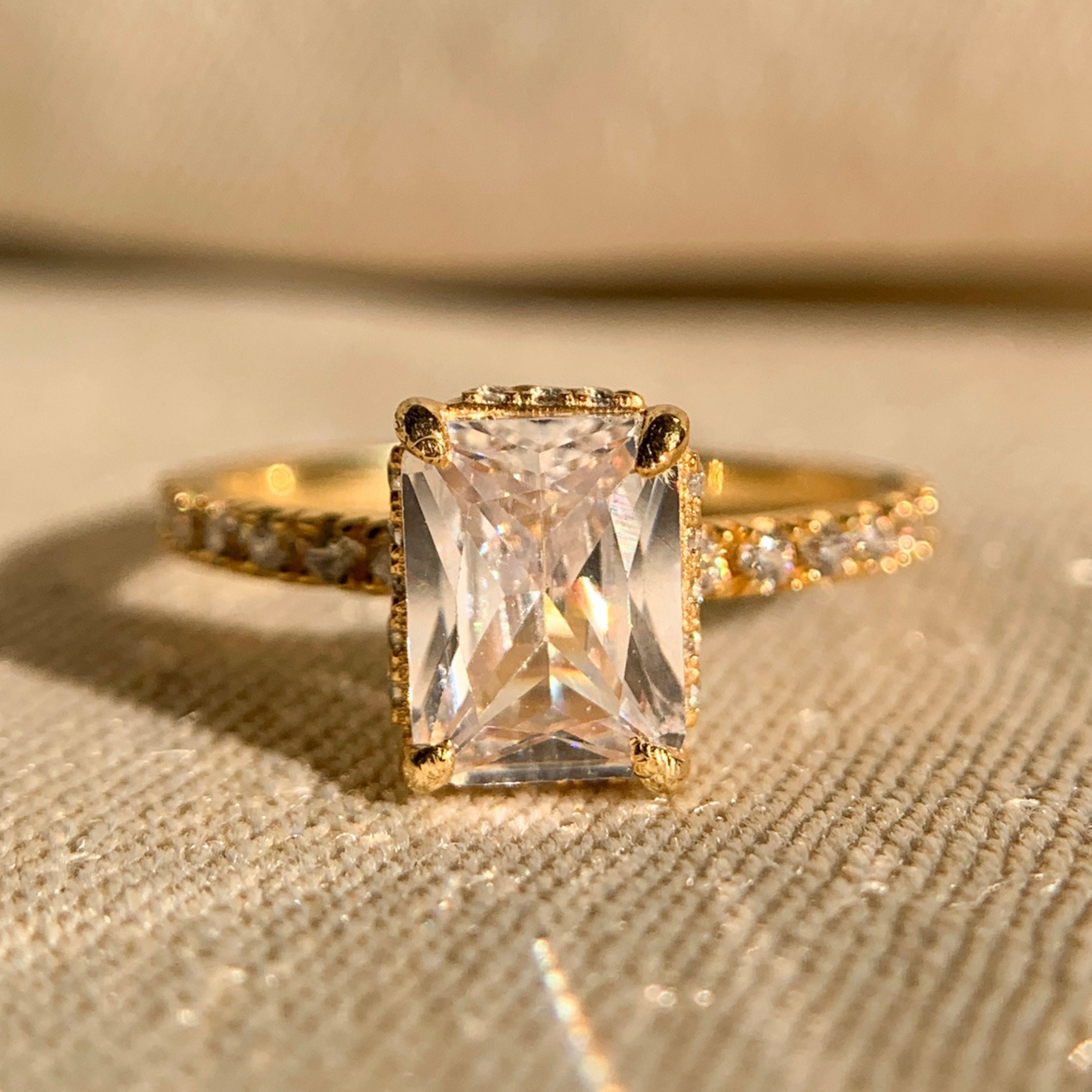 Radiant cut moissanite engagement ring with hidden halo in white gold